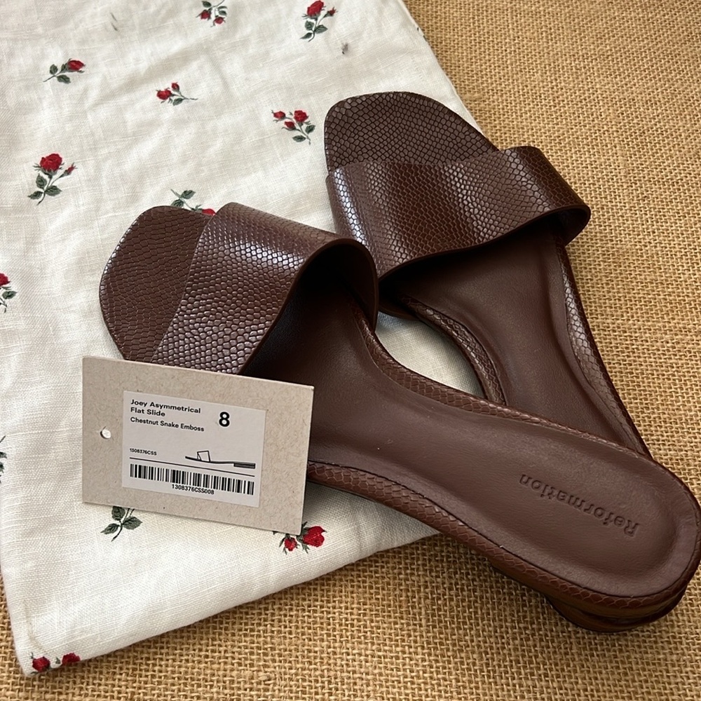 REFORMATION- Never worn Joey Asymmetrical Flat Slide / Chestnut Snake Emboss